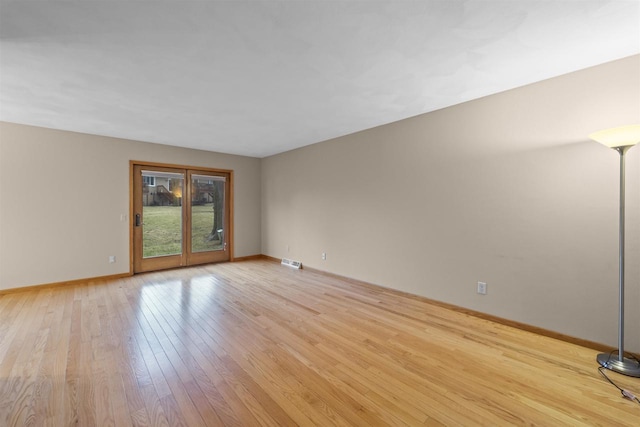 314 Castle Oaks Xing, Waunakee, WI 53597 - spare room featuring light wood-style floors and baseboards