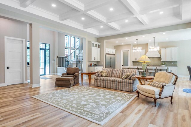 4779 Pine Meadows Ln, Hartland, WI 53029 - living area with beam ceiling, stairway, recessed lighting, and light wood-style flooring
