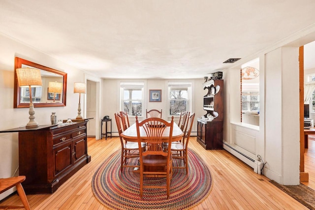 6112 County Road A, Brooklyn, WI 53521 - dining space featuring light wood-style floors and baseboard heating