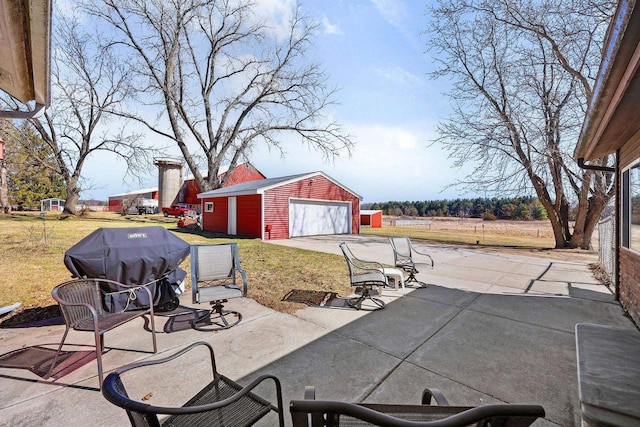 6112 County Road A, Brooklyn, WI 53521 - view of patio / terrace with a detached garage, an outdoor structure, and concrete driveway
