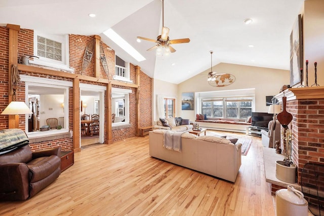 6112 County Road A, Brooklyn, WI 53521 - living area with hardwood / wood-style floors, high vaulted ceiling, a fireplace, and a ceiling fan