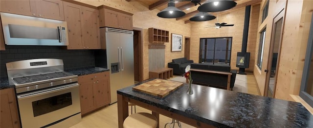 LOT45 Atlas Ln, Hayward, WI 54843 - kitchen with appliances with stainless steel finishes, dark countertops, a ceiling fan, tasteful backsplash, and beam ceiling