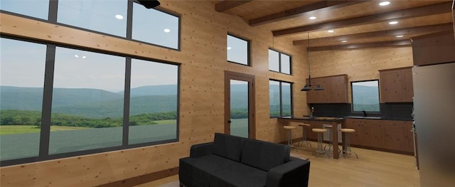 LOT45 Atlas Ln, Hayward, WI 54843 - living room featuring recessed lighting, light wood-type flooring, beam ceiling, a mountain view, and a towering ceiling