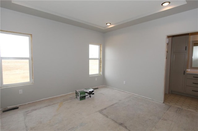 4607 933rd St, Elk Mound, WI 54739 - spare room featuring a raised ceiling, recessed lighting, and baseboards