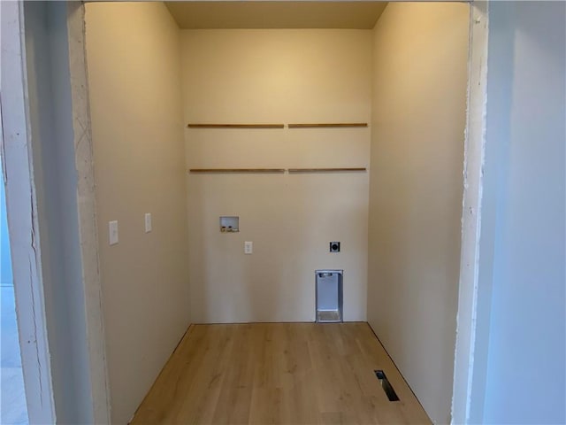 4607 933rd St, Elk Mound, WI 54739 - laundry area featuring electric dryer hookup, hookup for a washing machine, and light wood-style flooring