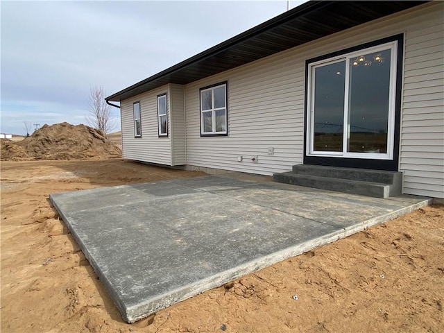 4607 933rd St, Elk Mound, WI 54739 - rear view of property featuring entry steps and a patio area