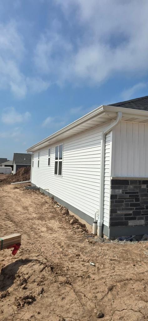 2023 Red Fox Ln, Kaukauna, WI 54130 - view of side of home with board and batten siding