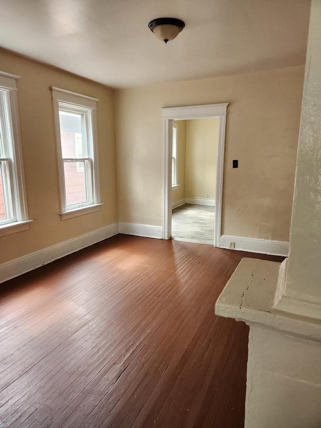 4047 N 19th St Unit 4049, Milwaukee, WI 53209 - unfurnished room featuring baseboards and wood-type flooring