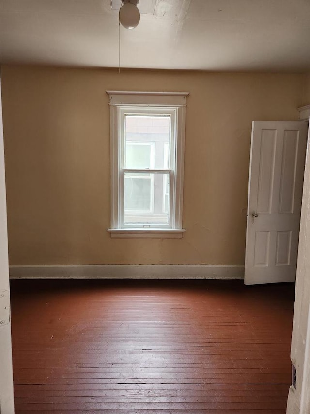 4047 N 19th St Unit 4049, Milwaukee, WI 53209 - empty room with dark wood-type flooring and baseboards
