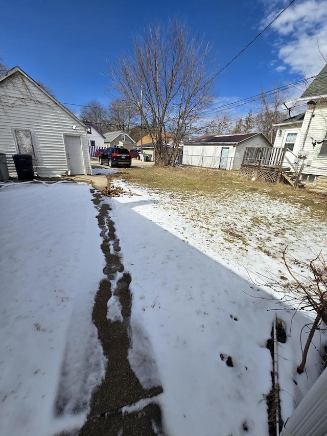view of yard layered in snow