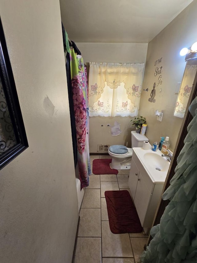 full bath featuring vanity, tile patterned floors, and toilet