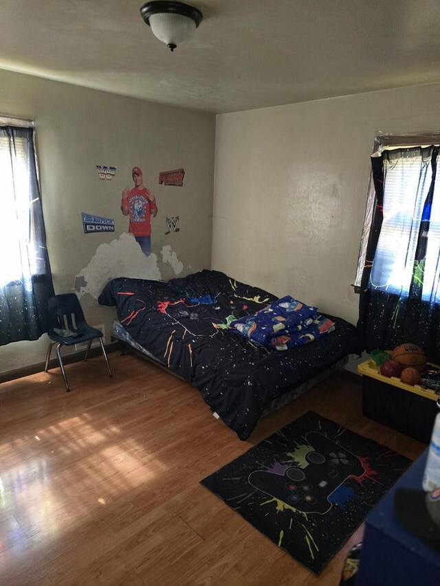 bedroom with wood finished floors