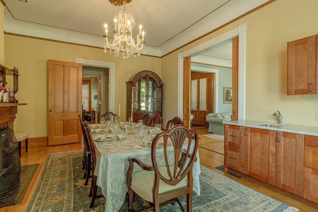 1222 11th St, Monroe, WI 53566 - dining area featuring dark wood-style floors and a chandelier