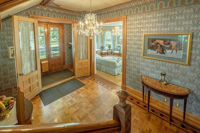 1222 11th St, Monroe, WI 53566 - foyer entrance featuring wallpapered walls, a chandelier, healthy amount of natural light, and baseboards