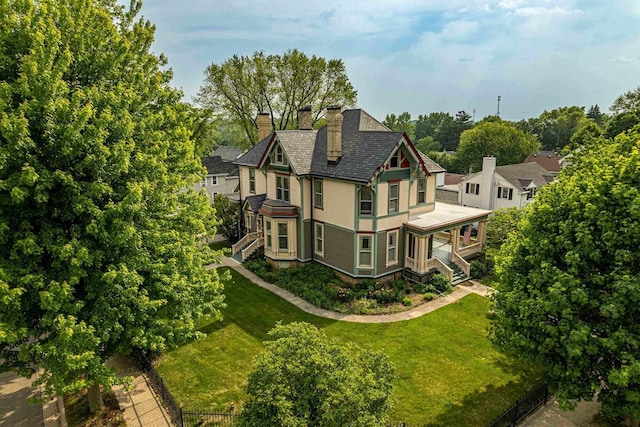 1222 11th St, Monroe, WI 53566 - view of side of property with a chimney and view of scattered trees