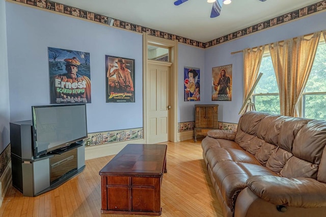 1222 11th St, Monroe, WI 53566 - living area featuring a ceiling fan, light wood finished floors, and baseboards