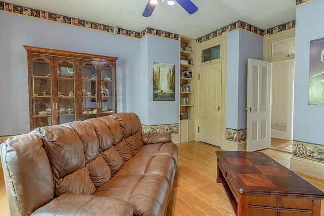 1222 11th St, Monroe, WI 53566 - living area featuring light wood finished floors, ceiling fan, and built in features