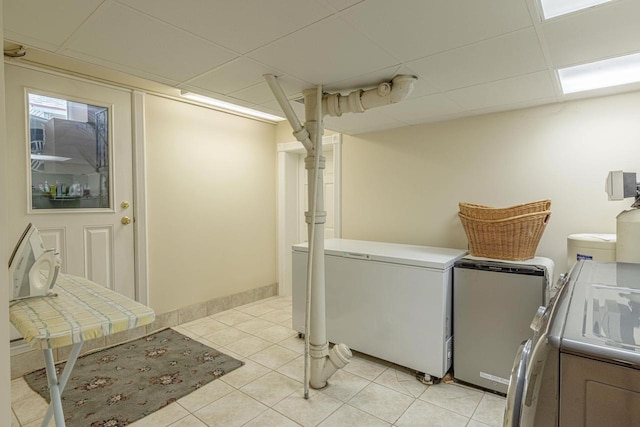 1222 11th St, Monroe, WI 53566 - laundry room with independent washer and dryer and light tile patterned flooring