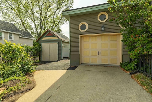 1222 11th St, Monroe, WI 53566 - detached garage with concrete driveway and a shed