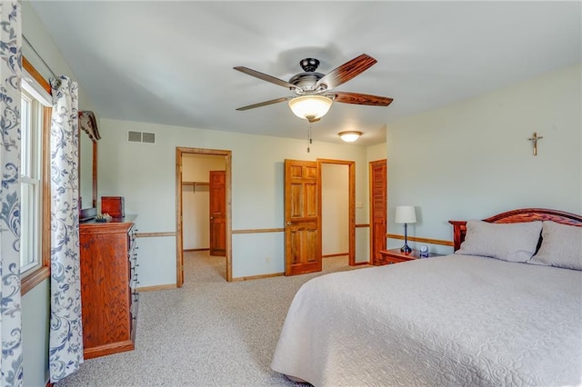 1353 Van Buren St, Black River Falls, WI 54615 - bedroom with visible vents, a walk in closet, a closet, carpet floors, and baseboards