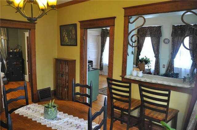 13600 8th St, Osseo, WI 54758 - dining room with an inviting chandelier and wood finished floors