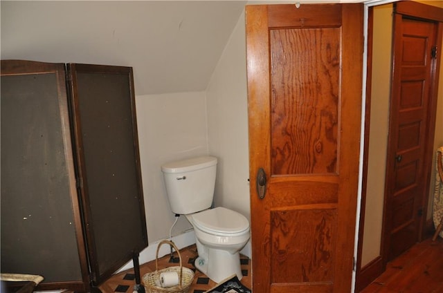 13600 8th St, Osseo, WI 54758 - bathroom with a stall shower, toilet, and vaulted ceiling