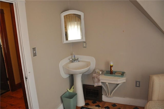 13600 8th St, Osseo, WI 54758 - bathroom featuring visible vents and wood finished floors