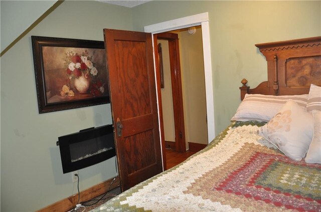 13600 8th St, Osseo, WI 54758 - bedroom with wood finished floors, baseboards, and a closet
