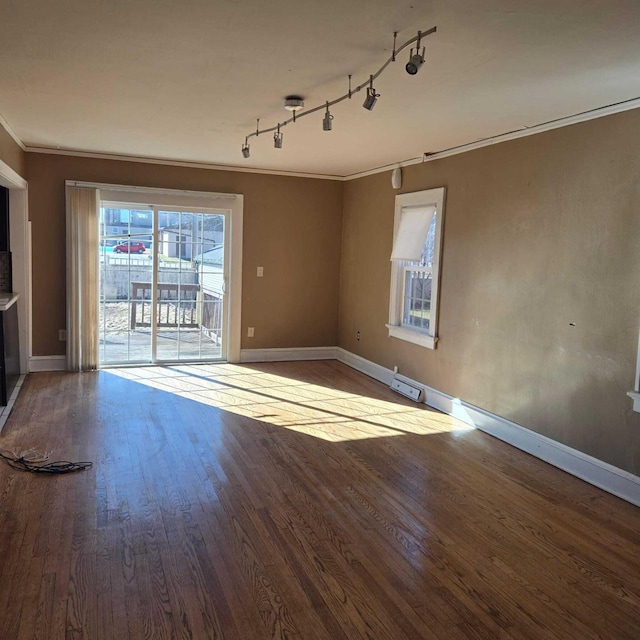 3731 S 56th St, Greenfield, WI 53220 - unfurnished room with crown molding, wood finished floors, baseboards, and track lighting