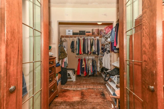 spacious closet featuring hardwood / wood-style flooring