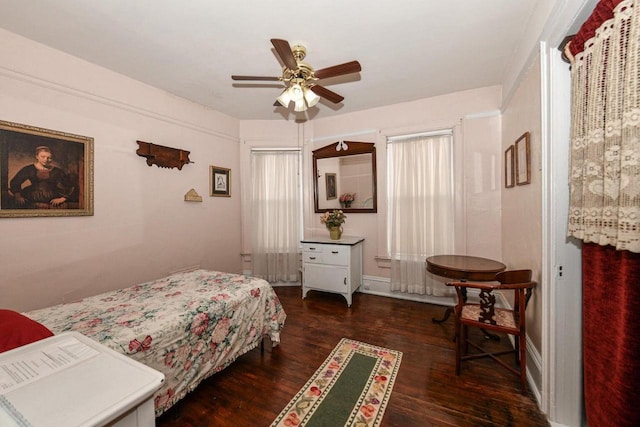 bedroom featuring ceiling fan and dark wood finished floors