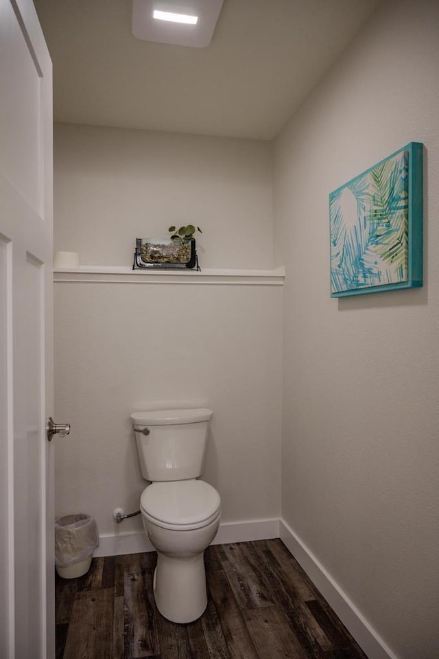 N9310 22nd Ave, Necedah, WI 54646 - bathroom with toilet, wood finished floors, and baseboards