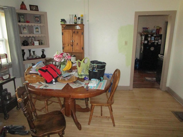 454 Center St, Adams, WI 53910 - dining room with light wood-type flooring and baseboards