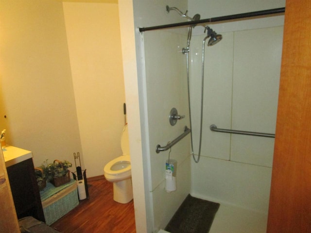 454 Center St, Adams, WI 53910 - full bath with a shower stall, wood finished floors, toilet, and vanity