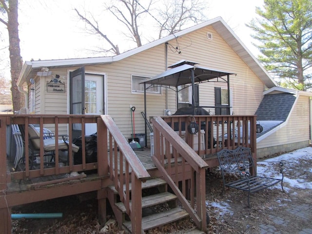 454 Center St, Adams, WI 53910 - rear view of house featuring a wooden deck and stairway
