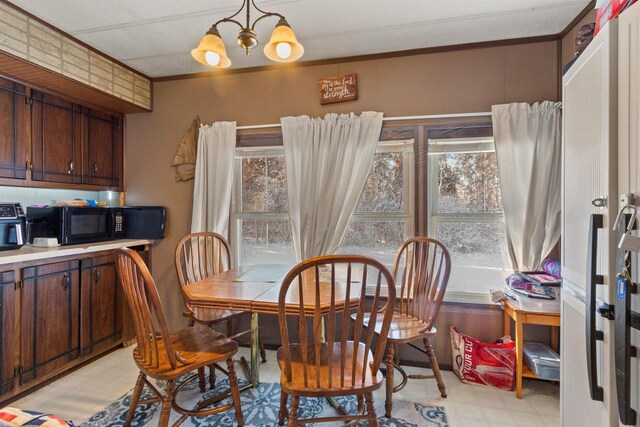 5830 Broadway St, Wisconsin Rapids, WI 54494 - dining room featuring a wealth of natural light, light floors, an inviting chandelier, and crown molding