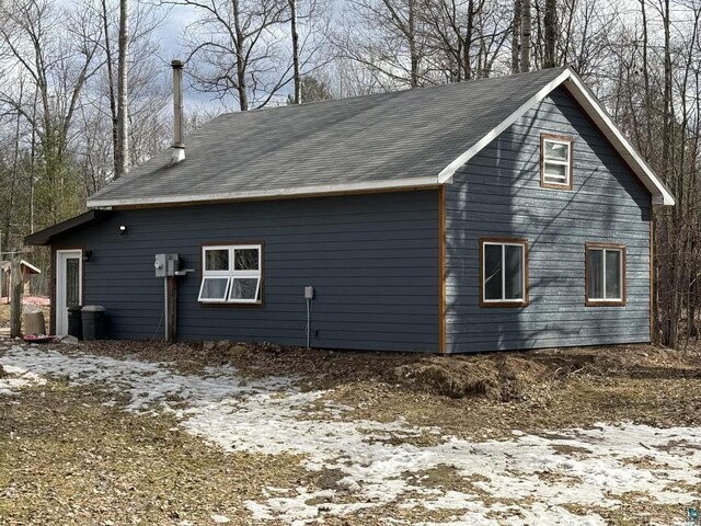 6955 Kolling Rd, Iron River, WI 54847 - view of side of home with a shingled roof