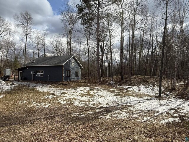 6955 Kolling Rd, Iron River, WI 54847 - view of snow covered property
