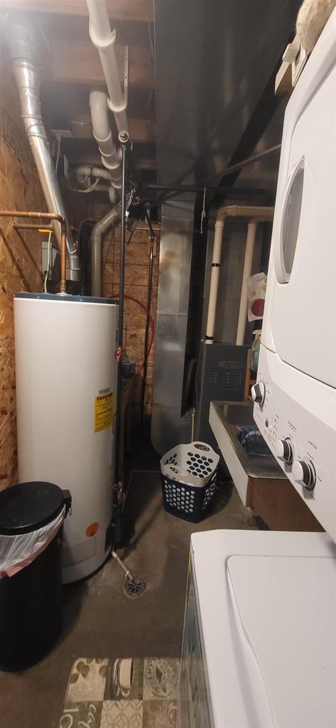 1116 Washington Ave, Stevens Point, WI 54481 - interior space with water heater and stacked washer and clothes dryer
