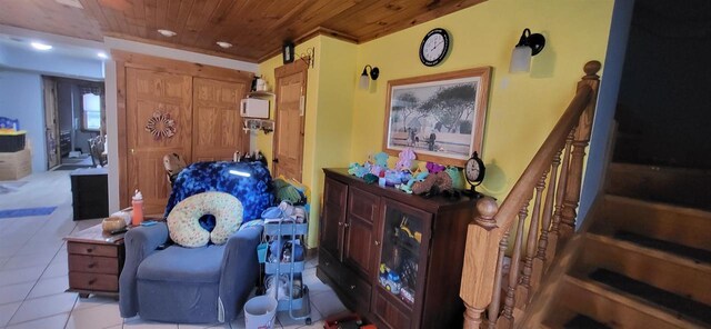 1116 Washington Ave, Stevens Point, WI 54481 - sitting room featuring tile patterned flooring, wooden ceiling, and stairs