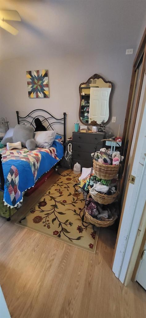 1116 Washington Ave, Stevens Point, WI 54481 - bedroom with ceiling fan and wood finished floors