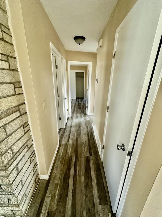 7140 N 48th St, Milwaukee, WI 53223 - hall with dark wood-type flooring and baseboards