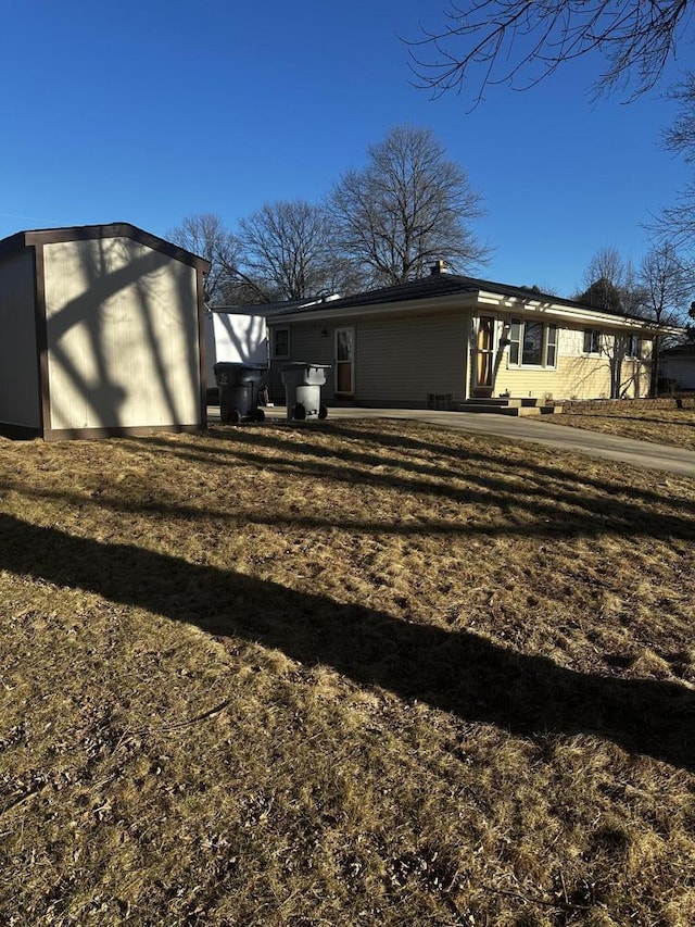 7140 N 48th St, Milwaukee, WI 53223 - exterior space with an outbuilding and a lawn