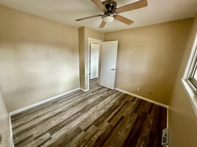 7140 N 48th St, Milwaukee, WI 53223 - spare room featuring ceiling fan, baseboards, visible vents, and wood finished floors