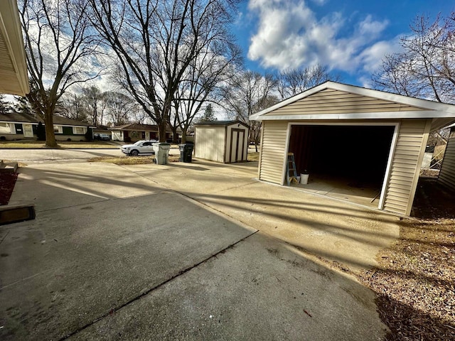 7140 N 48th St, Milwaukee, WI 53223 - detached garage featuring concrete driveway
