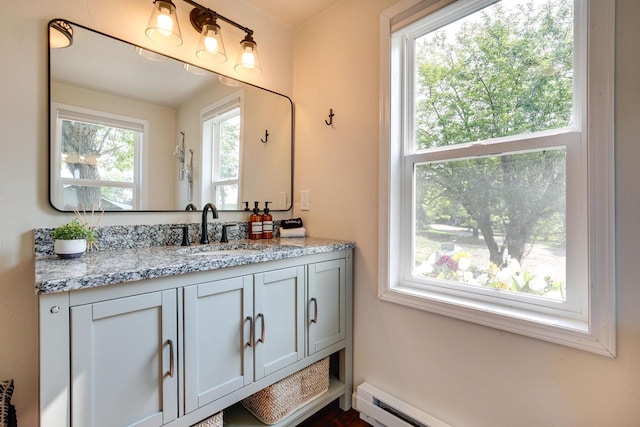 bathroom featuring a baseboard radiator and vanity