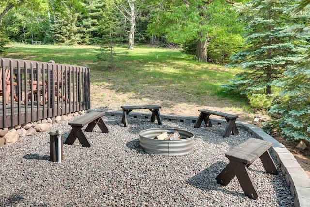 view of yard featuring an outdoor fire pit