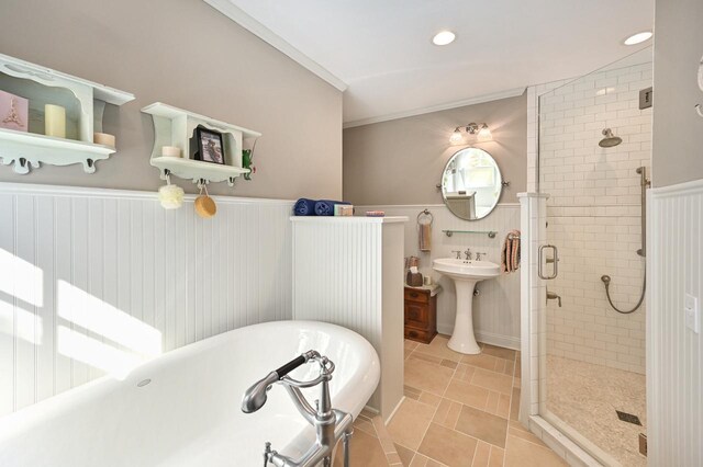 N8512 Booth Lake Heights Rd, East Troy, WI 53120 - bathroom with a shower stall, wainscoting, a freestanding tub, and tile patterned flooring