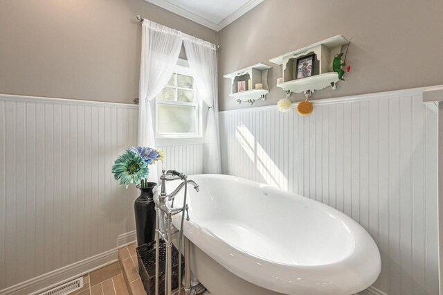 N8512 Booth Lake Heights Rd, East Troy, WI 53120 - full bathroom with a wainscoted wall, visible vents, a freestanding tub, and ornamental molding
