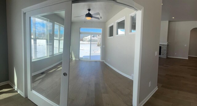 3371 Capellla Ln, Green Bay, WI 54311 - corridor featuring baseboards, wood finished floors, and arched walkways